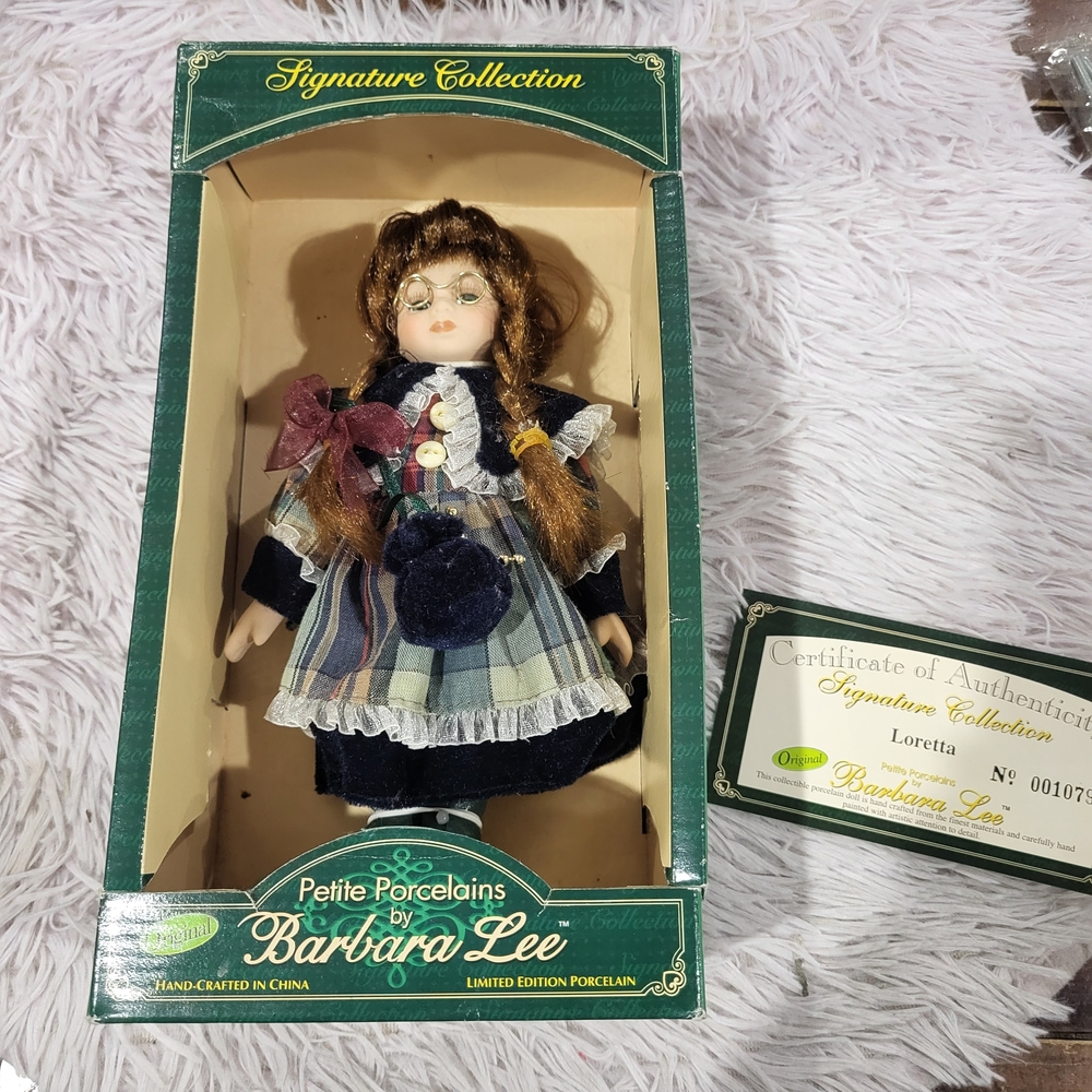 Porcelain Doll with Brown Hair and Blue Dress